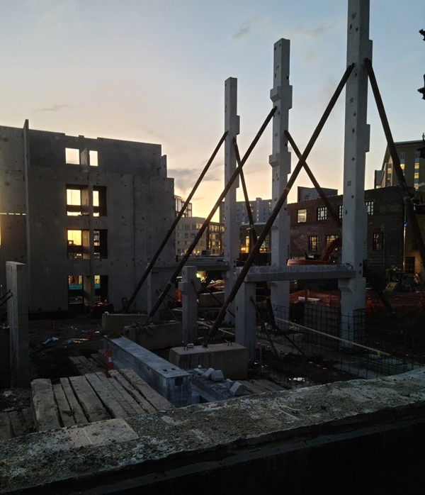 Precast concrete columns and shear walls erected by Concrete Erectors, Inc. during structural build