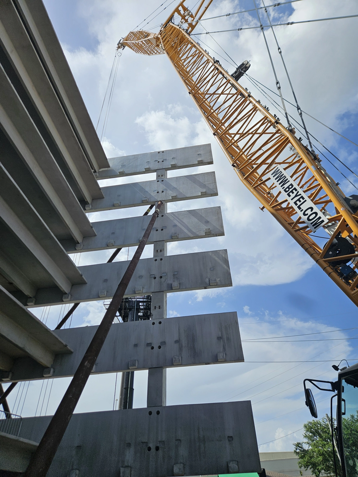 Precast concrete panel being installed at parking garage by Concrete Erectors, Inc