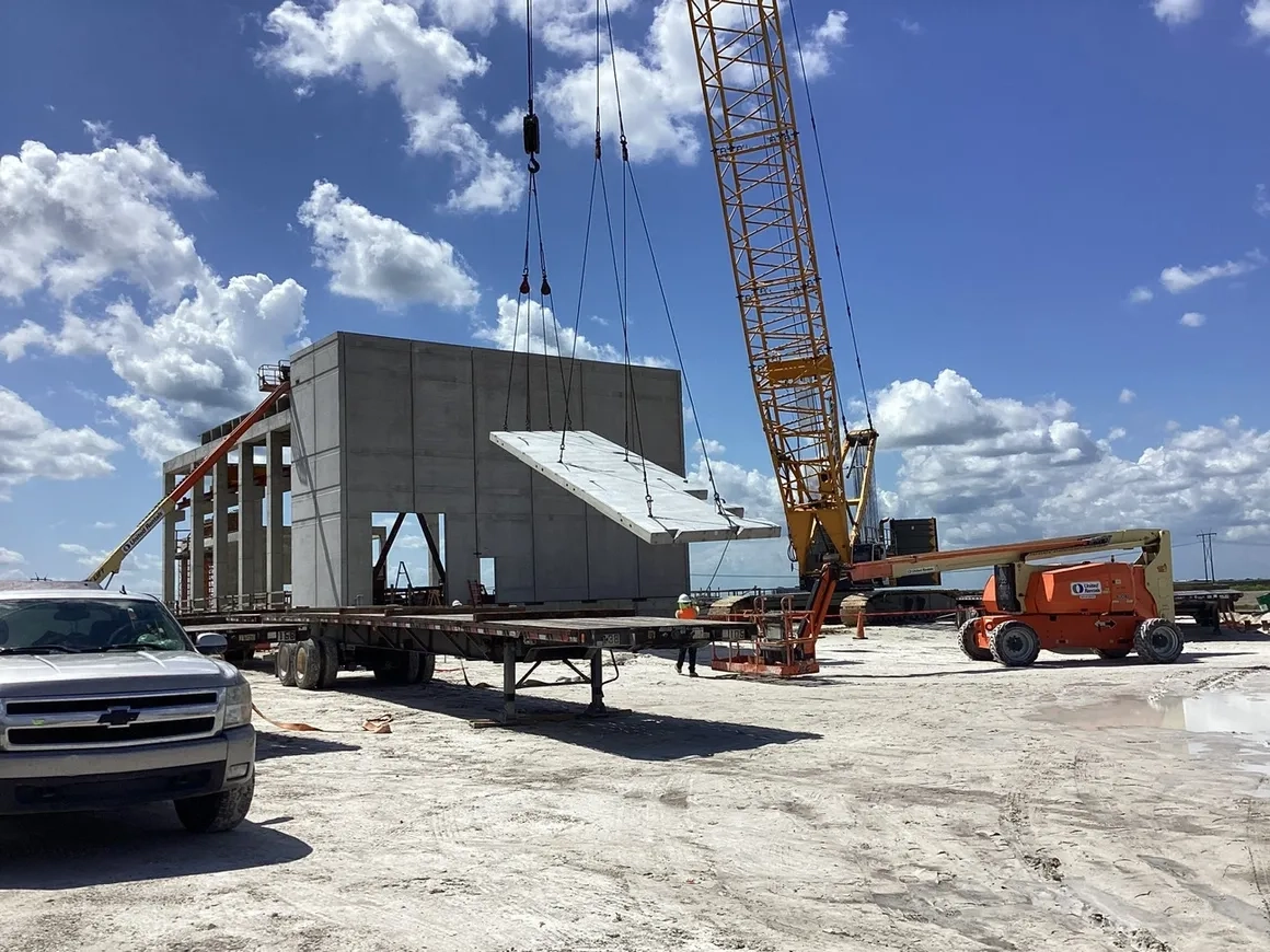Precast concrete panel being placed on commercial jobsite by Concrete Erectors, Inc
