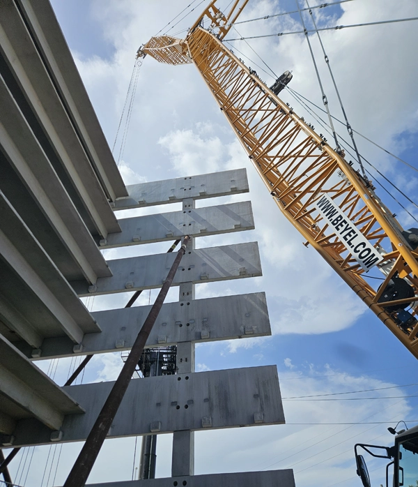 Precast concrete spandrel beams installed by Concrete Erectors, Inc. during structural garage erection